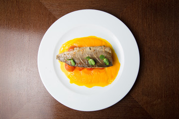 Grilled fish on tomatoes
