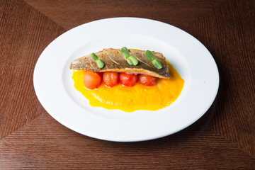 Grilled fish on tomatoes
