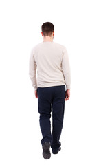 Fototapeta premium back view of Business man looks. Rear view people collection. backside view of person. Isolated over white background. The bearded man in a white warm sweater is slowly moving forward.