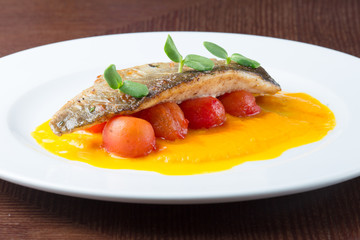 Grilled fish on tomatoes
