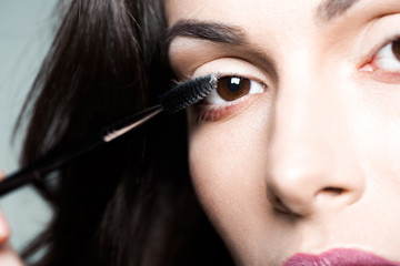 Obraz premium pretty woman with mascara brush