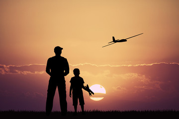 remote controlled airplanes at sunset - obrazy, fototapety, plakaty
