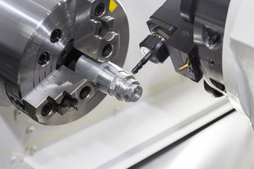 Steel metal cutting machine process by CNC lathe in workshop