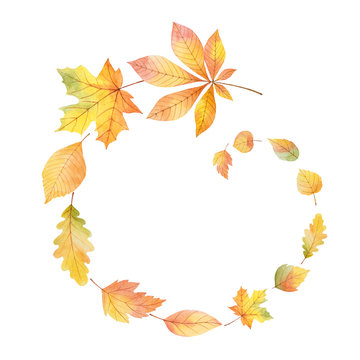 Watercolor round frame with colored leaves on a white background.