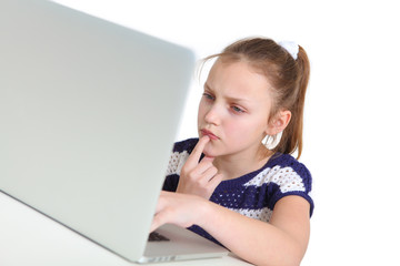 preteen girl using laptop on white background