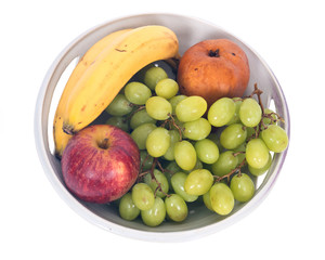 Organic fruits in berry bowl separated on white background