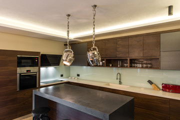 Wooden table and chandeliers in luxury home interior