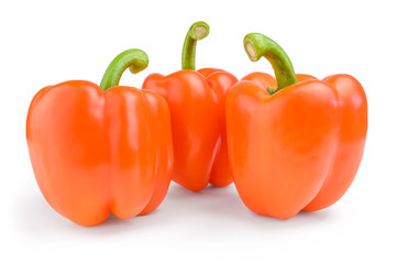 Three red sweet bulgarian peppers isolated on white background