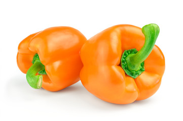 Two sweet orange pepper isolated on white background