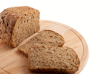 Black bread with sunflower seeds of a rough grinding cut by piec