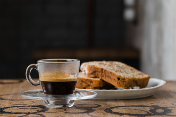espresso with a cake on table