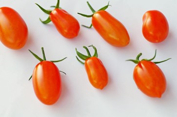 Fresh organic tomatoes cherry on white background.