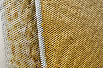 A dirty, greasy aluminum filter for cooker hood