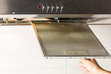 Take the aluminum mesh filter out of  the cooker hood