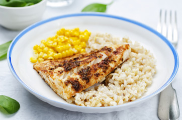 spices Cod with brown rice, spinach and corn