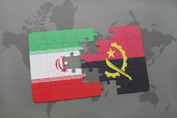 puzzle with the national flag of iran and angola on a world map background.