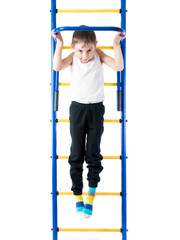 Little boy pulls up on the sports Horizontal bars ON A WHITE BACKGROUND