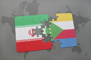 puzzle with the national flag of iran and comoros on a world map background.