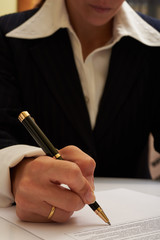 business woman sign document