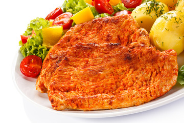 Fried chicken fillets, boiled potatoes and vegetable salad 