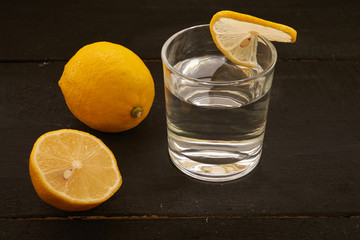 lemon and a glass of water on the table