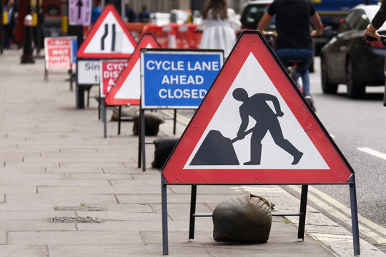 Cycle Lane Closed To Cyclists Due To Road Works Showing Safety Signs.