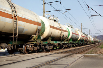 Fototapeta na wymiar old train wagons crossing railway and transporting goods carriag