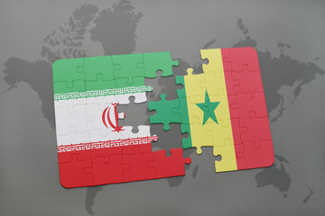 puzzle with the national flag of iran and senegal on a world map background.