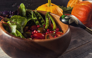 Green salad in wooden bowl