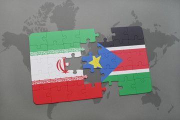 puzzle with the national flag of iran and south sudan on a world map background.