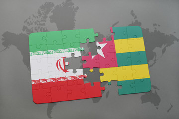 puzzle with the national flag of iran and togo on a world map background.