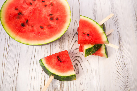 Tasty watermelon popsicle yummy fresh summer fruit on white wood