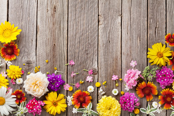 Garden flowers over wooden background