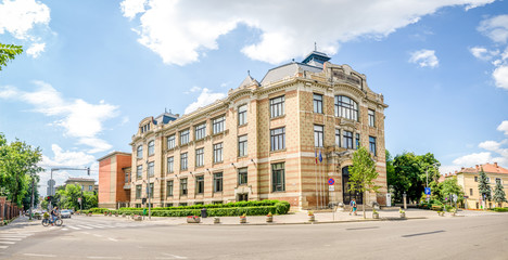 Lucian Blaga Central University Library in this beautiful Transylvanian City in Romania build in art nouveau or wiener secession architectural style with a warm bright look - obrazy, fototapety, plakaty