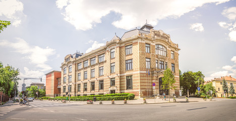 Fototapeta na wymiar Lucian Blaga Central University Library in this beautiful Transylvanian City in Romania build in art nouveau or wiener secession architectural style with soft filters applied for a warm bright look