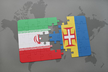 puzzle with the national flag of iran and madeira on a world map background.
