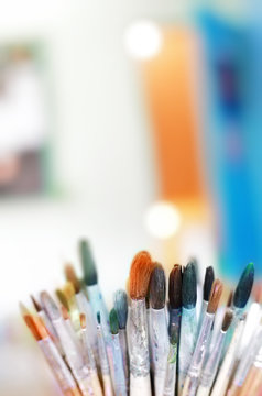 Group of old used paint brushes with clean background,soft focus.
