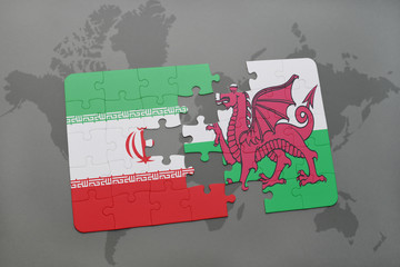 puzzle with the national flag of iran and wales on a world map background.