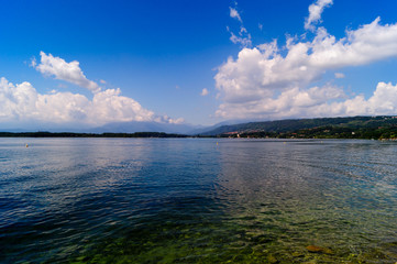 Lake of Viverone panorama with mountains on horizon.