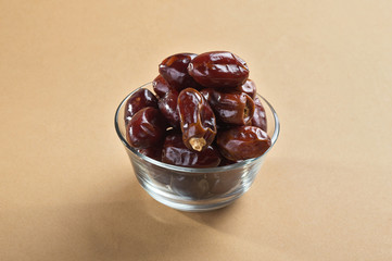 Dates in glass bowl. Dries dates fruit