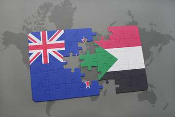 puzzle with the national flag of new zealand and sudan on a world map background.