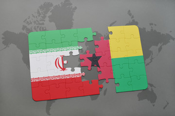 puzzle with the national flag of iran and guinea bissau on a world map background.
