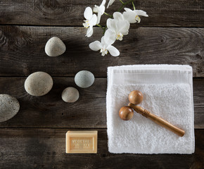 beauty feng shui wallpaper with pebbles, flowers, towel and massager