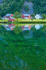 Norwegian country houses in the mountains on lake shore