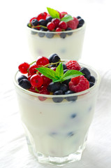 Sweet dessert, pudding, panna cotta with mix berries and mint