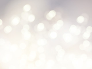 Vector bokeh background. Festive defocused white lights. Abstract blurred illustration.