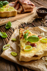 Traditional French Quiche Lorraine with Cheddar, Camembert, bacon and eggs