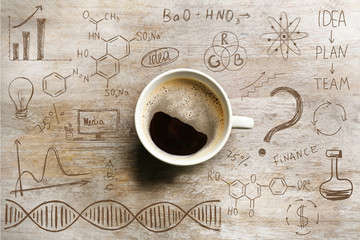 Cup of tasty coffee on wooden background. Sketch of business plan.