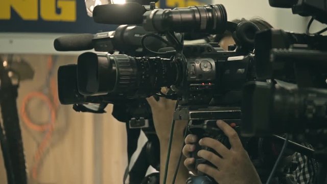 News conference. Filming an event with a video camera.