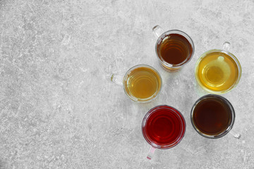 Cups of tea on table, top view